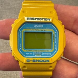 Casio G-Shock Yellow Watch with Blue Dial Accents